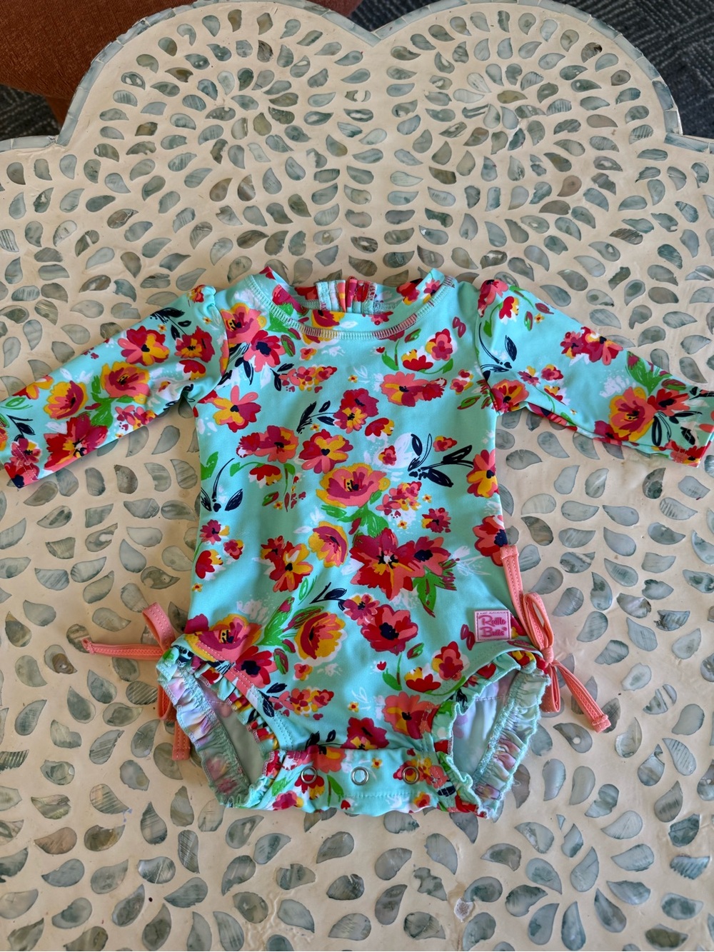 Ruffle Butts Aqua Floral Baby Swimsuit with Pink, Red and Yellow Flowers